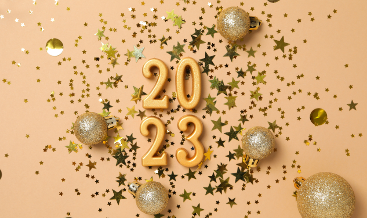 numbers 2023 in gold with sequins and sparkles surrounding