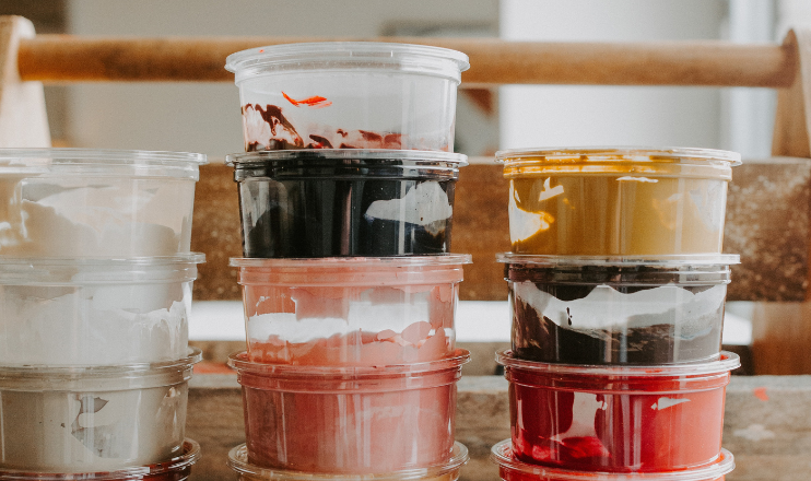 Pinot & Picasso Pictue of tubs of different coloured containers of paints